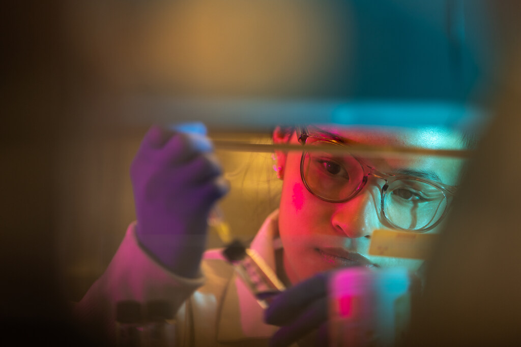 A photo of a student researching in a lab