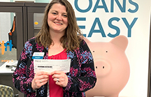 Missouri Credit Union's Casey L. Gentry with $1,500 check