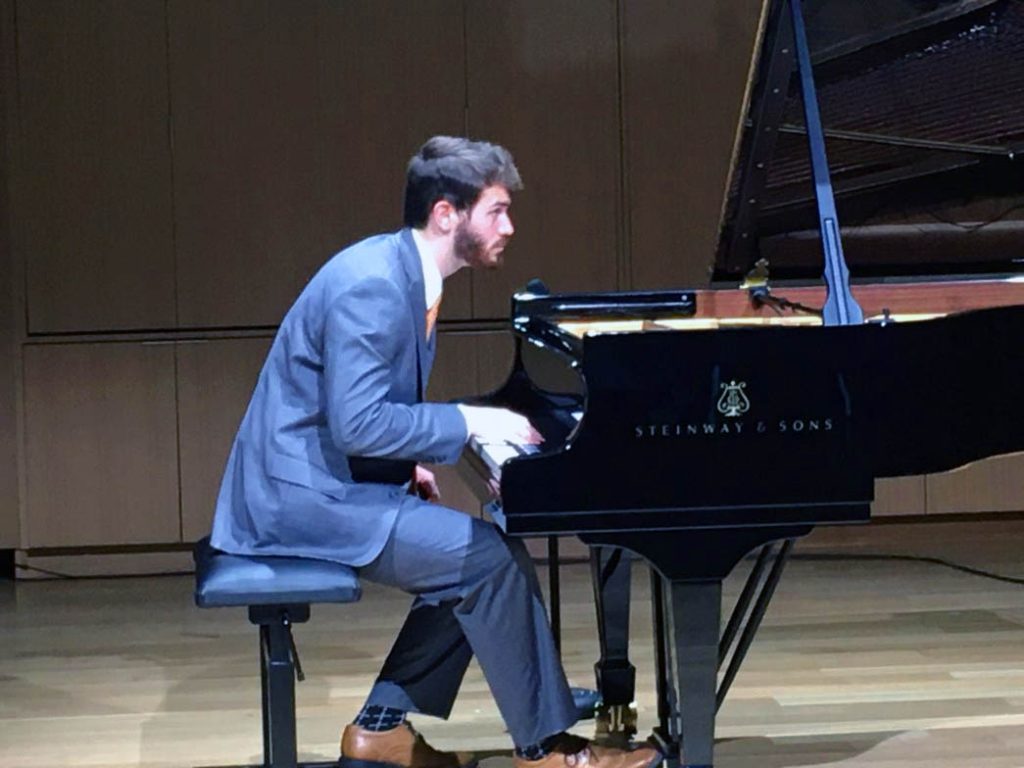 Photo of Graham Bond playing the piano on stage