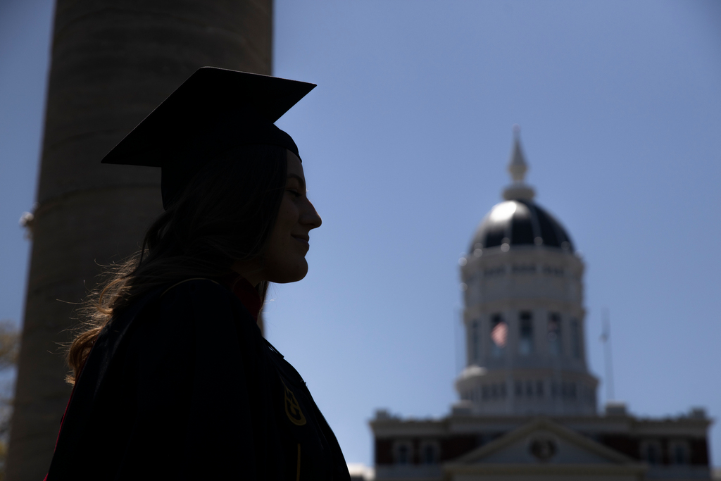 diploma cover handed to student