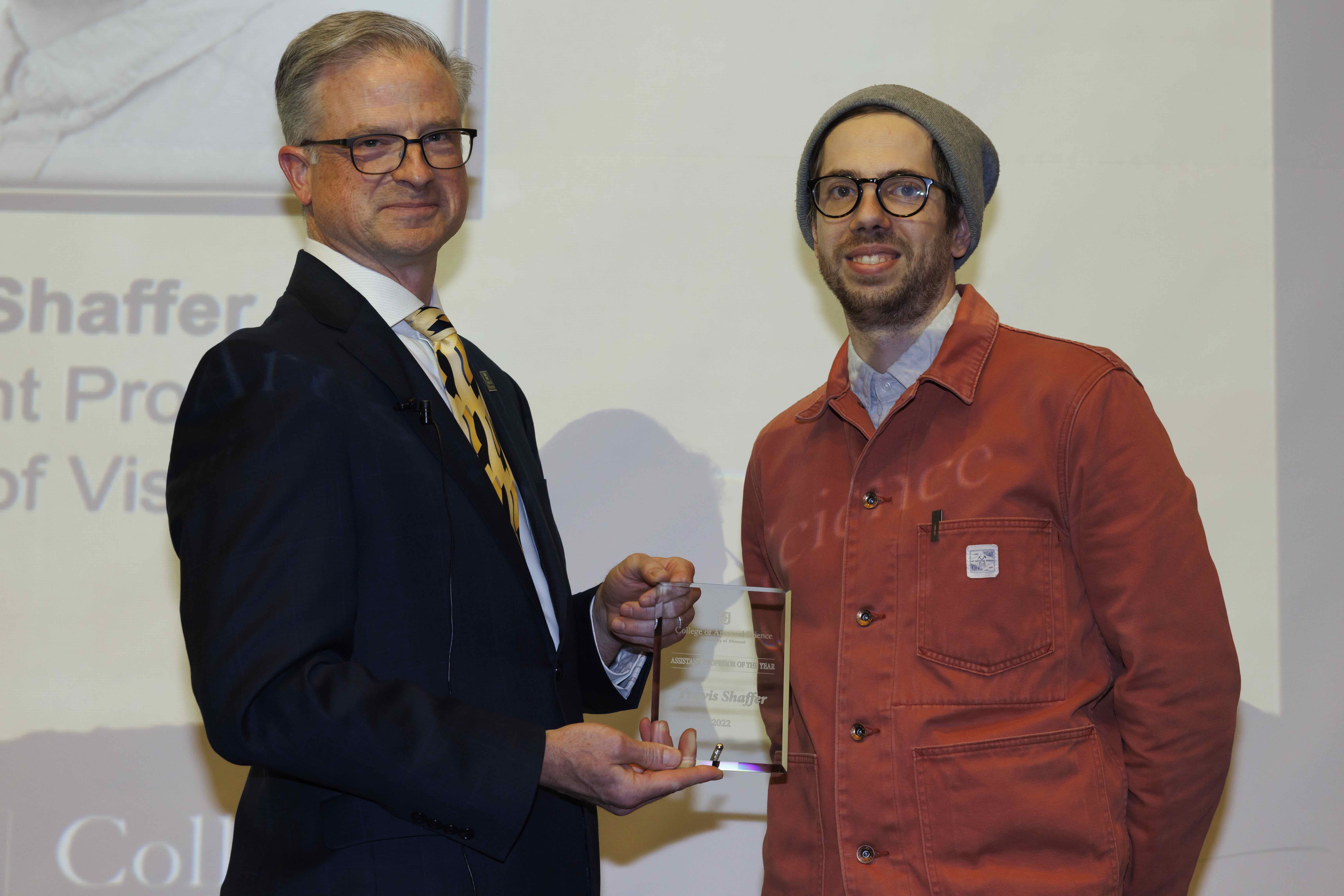 Photo of Travis Shaffer receiving his award.