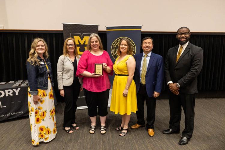 Holly Oswald award presentation photo