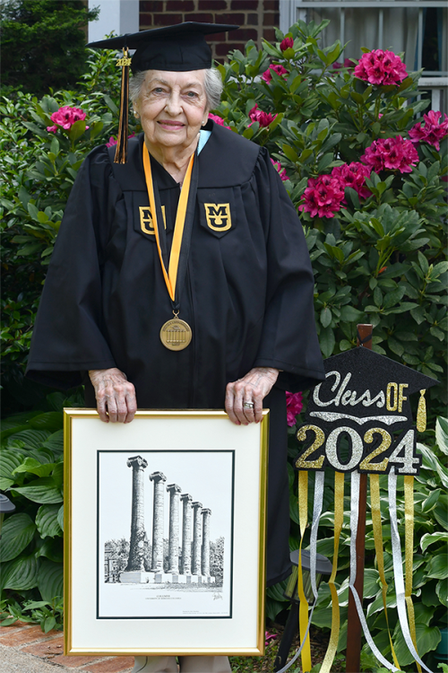 Mary Ellen Foley with graduation regalia