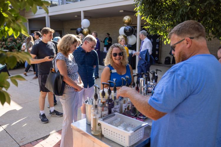 vendor serves lemonade to attendees