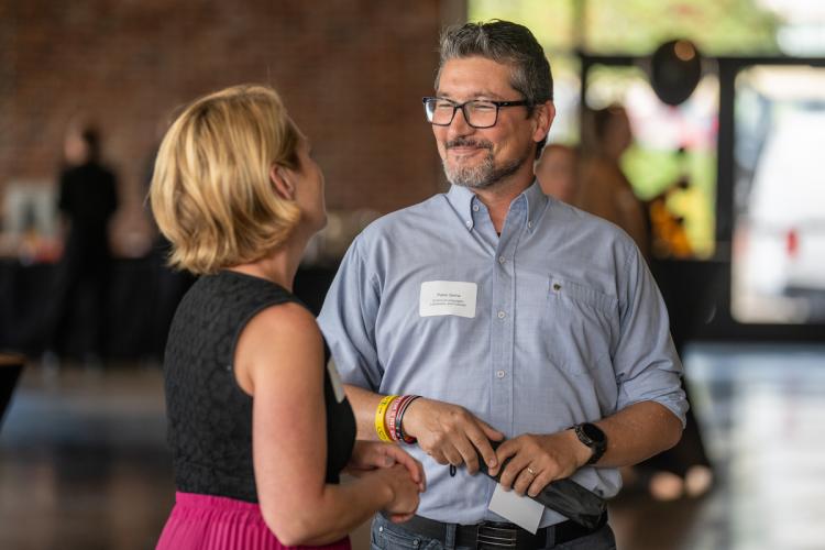 attendees talk at reception