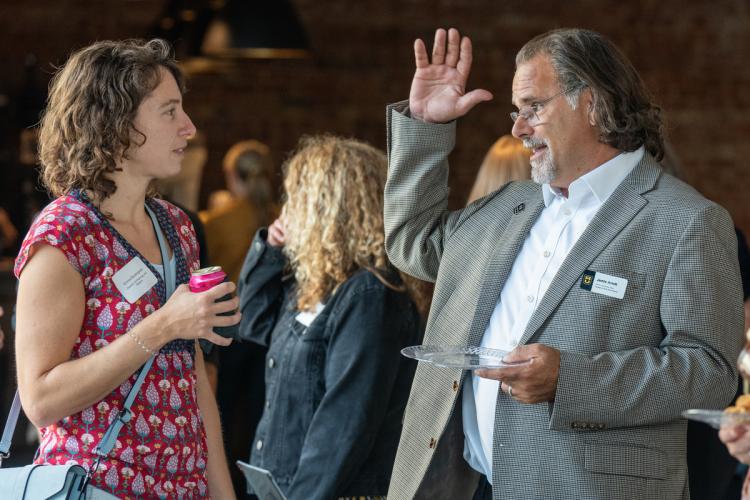 attendees talk at reception