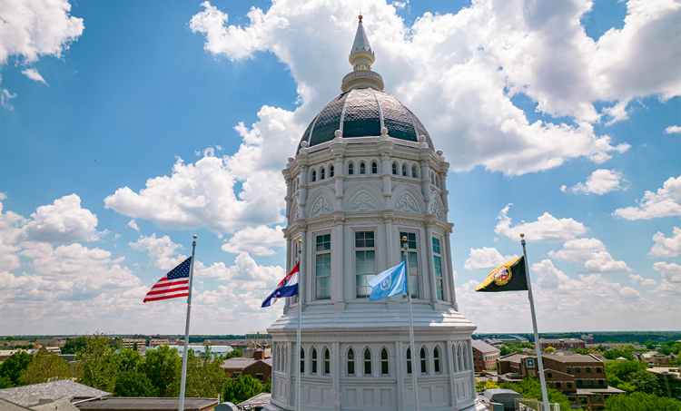 Jesse dome with flags and campus scenery