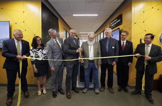 Group of Mizzou Leaders Cutting a Yellow Ribbon
